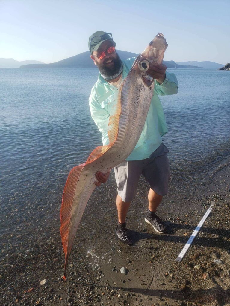 Marine biologist hold fish